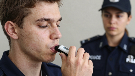 driver blowing into breathalyzer generated with Z-Image