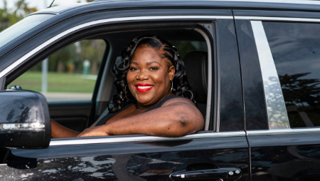 woman driving new car after converting policy generated with Z-Image